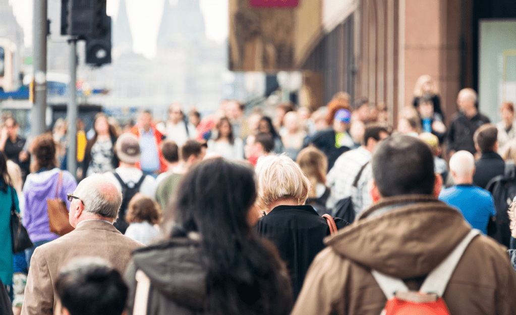 People waking down a busy street in a city centre